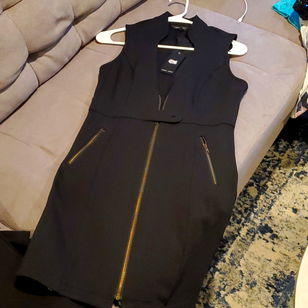Black dress. Casual, zippered pockets.